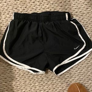 women’s black Nike running shorts.